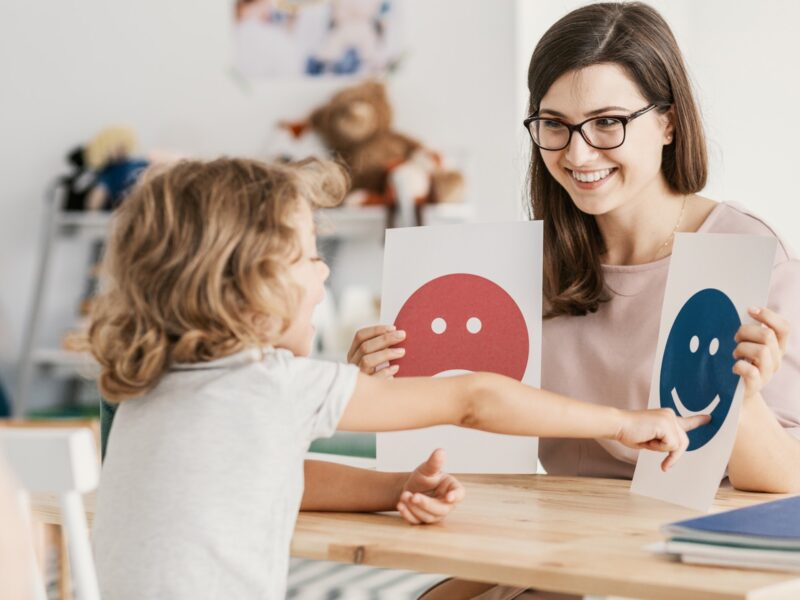 Emotion emoticons used by a psychologist during a therapy session with a child with an autism spectrum disorder. Emotion emoticons used by a psychologist during a therapy session with a child with an autism spectrum disorder.